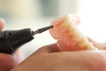 dentist making a set of dentures in bonita springs