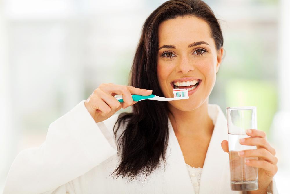 lady ready to brush her teeth