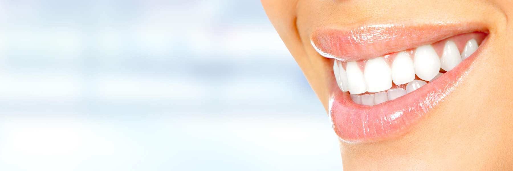 A person smiling with their teeth visible