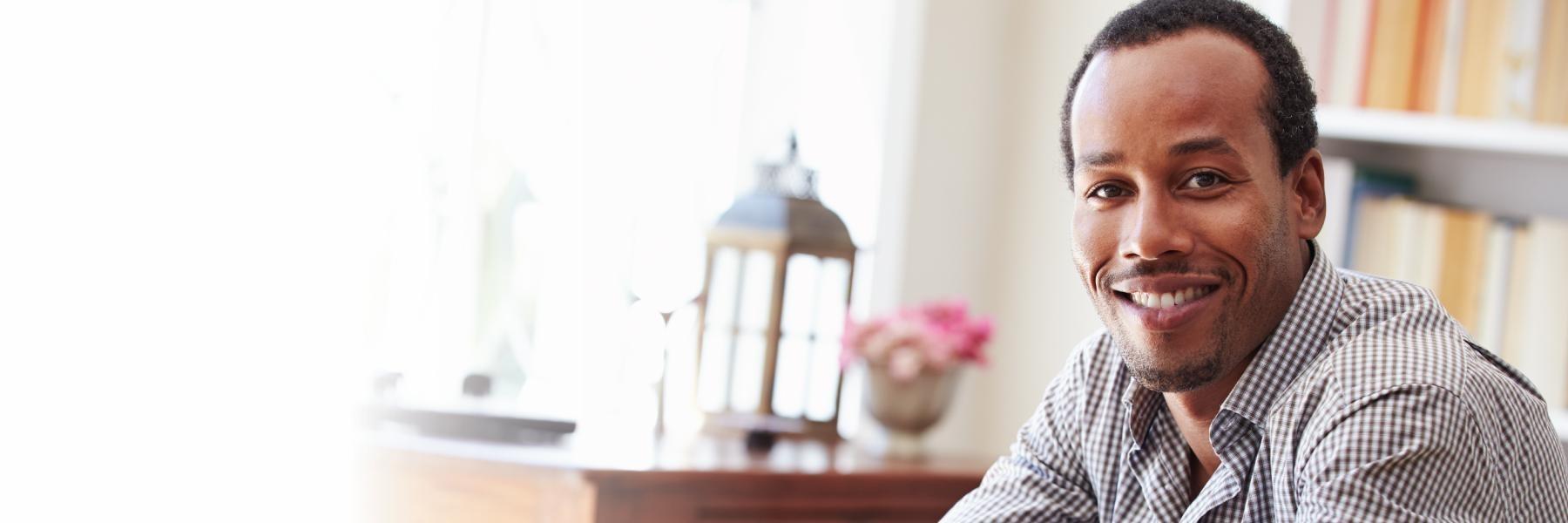 Man smiling after teeth whitening procedure in 34135