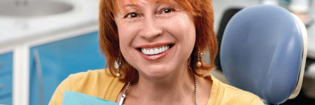 Female patient smiles after a tooth extraction in Bonita Springs FL