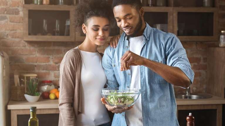 Couple in Bonita springs preparing healthy meal | Dental implant