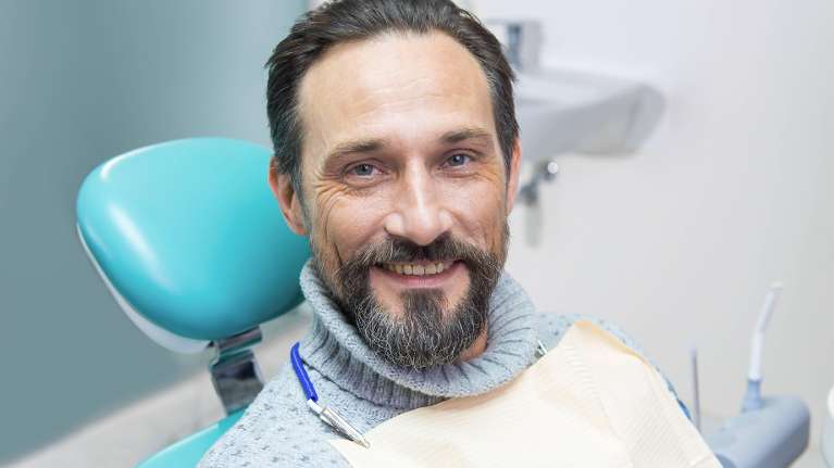 man getting a tooth extracted in bonita springs fl