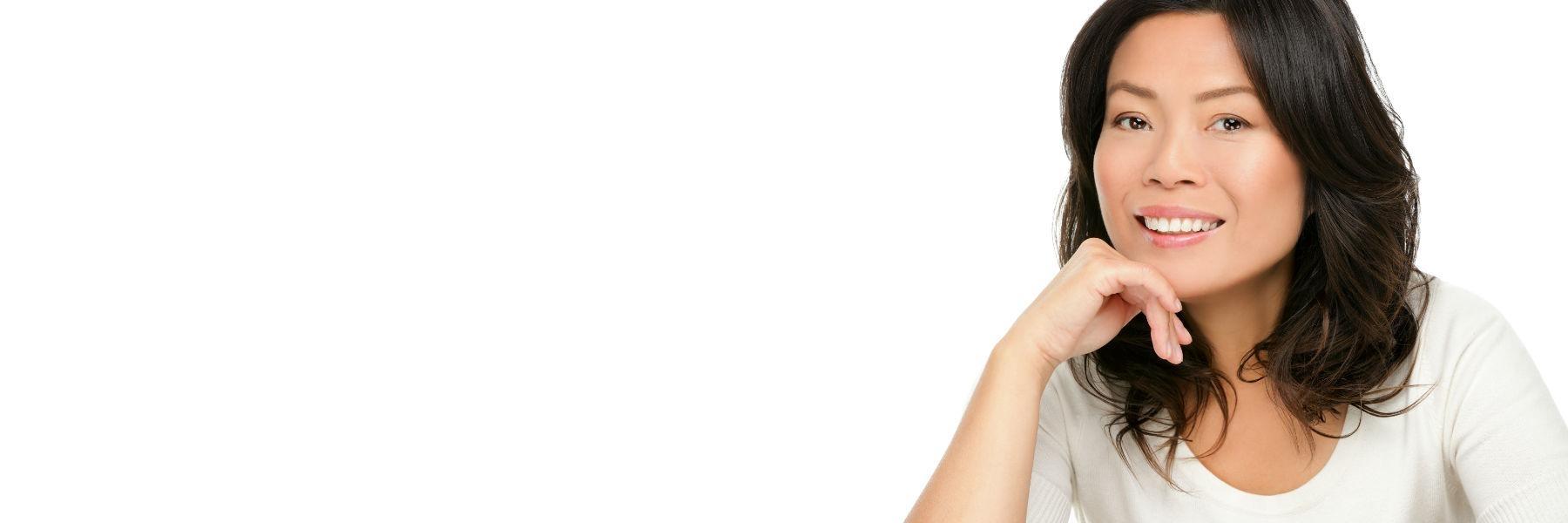 Woman smiling at implant dentist in Bonita Springs, FL