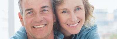 older couple wearing snap on dentures in bonita springs